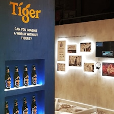 Bridging Design and Conservation: Tiger Awareness Exhibition in Singapore. Studio Königshausen showcases the brand's innovative approach—using thermochromic ink on limited edition cans to make the iconic tiger reappear when chilled.